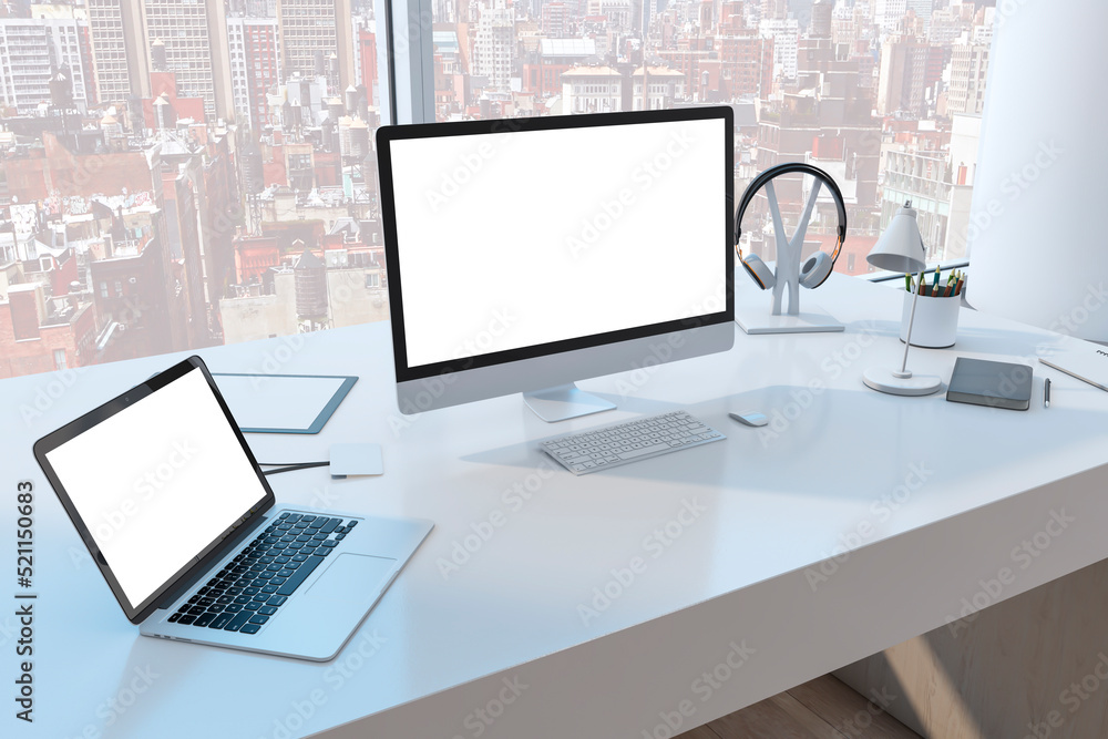 Close up of creative desktop with empty white mock up computer monitor laptop and supplies in modern office with window and panoramic city view. 3D Rendering. Close up of creative desktop with empty white mock up computer monitor laptop and supplies in modern office with window and panoramic city view. 3D Rendering.