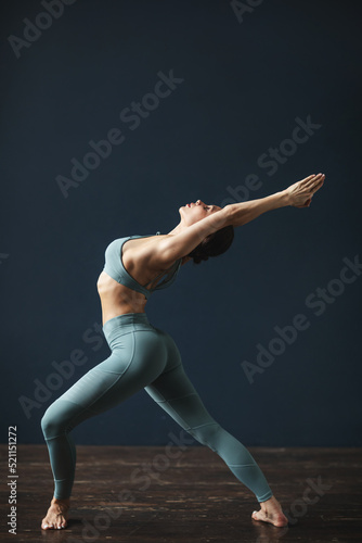 Fitness woman in sportswear doing stretching exercises