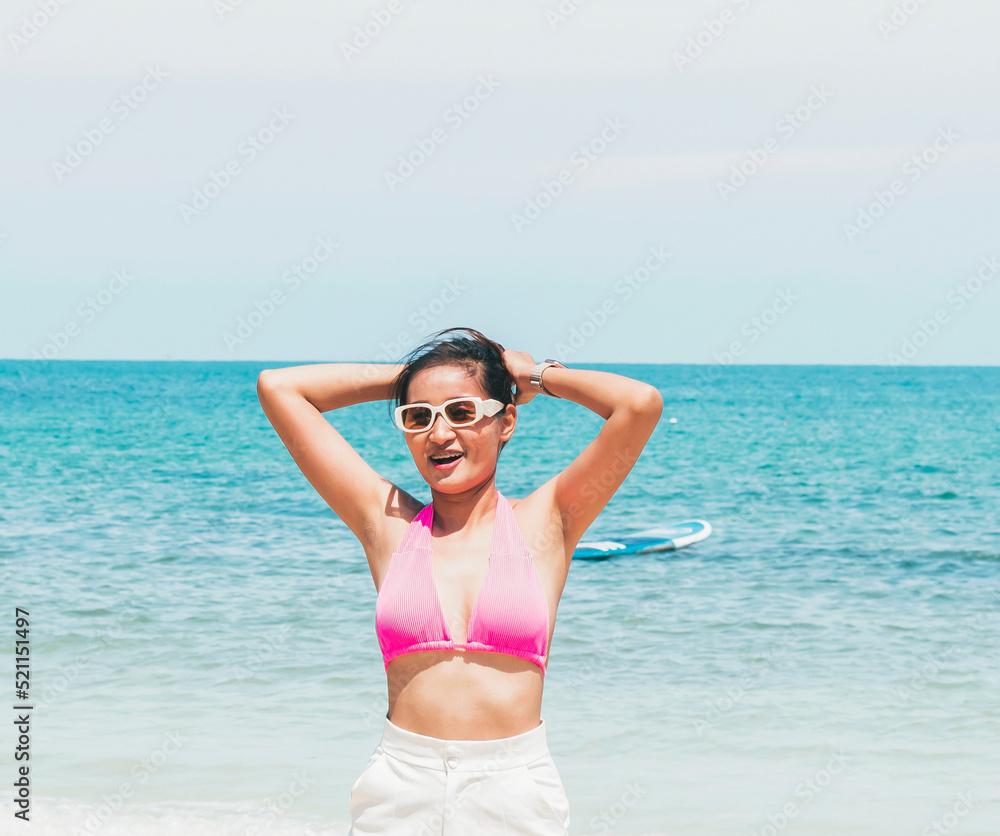 beach woman posing for a photo smiling happy beach woman posing for a photo smiling happy