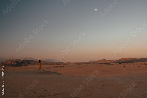 Woman in the desert at dawn