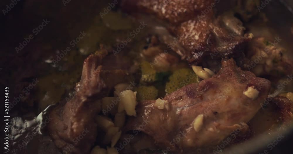 Close-up of duck prey inside a pot to be cooked. Slow Motion 4k. Close-up of duck prey inside a pot to be cooked. Slow Motion 4k.