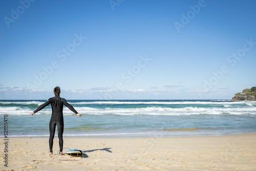 Surfer getting ready to surf at Bondi Beach