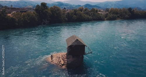A house on a rock on the Drina River in Serbia photo