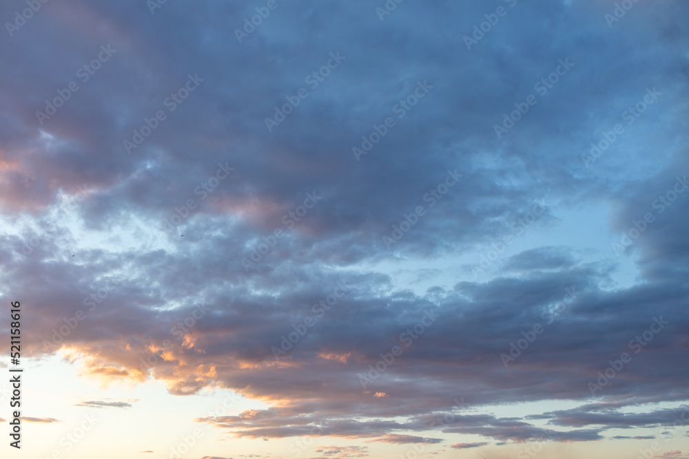Clouds in the sky at sunset background.