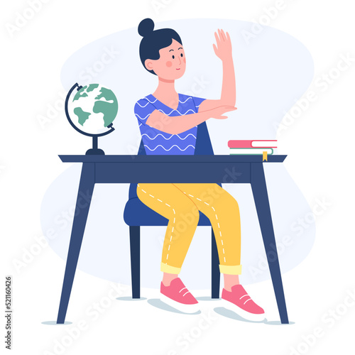 Girl raising hand at a desk. Smiling girl studies at school.