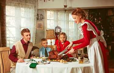 Family having a thanksgiving dinner together, 50s retro style 