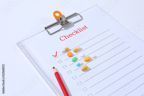 Wallpaper Mural Different medical pills lay with red pen and checklist. Concept of taking pills on time, regularly, Torontodigital.ca