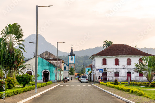 The beautiful and colorful city of Santo António with the Pico Papagaio as a backdrop, both on the tropical island of Príncipe.