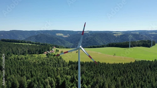Aerial video of wind power plant on the hilltop between fir trees. St. Peter, Black forest, Germany.
Concept  for regenerative energy and energy crisis.