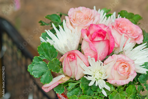 Close up view of a beautiful bouquet of mixed coloful flowers . The concept of a flower shop and flower delivery as a family business, florist work.