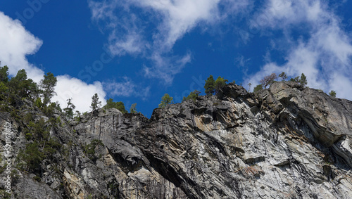 High cliff in the nature of Norway landscape with blue sky clouds in the background