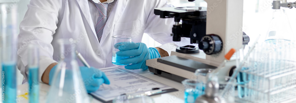Laboratory diagnosis of synthetic substances, Scientist or researcher examines the substance in vitro and record information, Lab experiments, Researchers scientist working analysis with test tube. Laboratory diagnosis of synthetic substances, Scientist or researcher examines the substance in vitro and record information, Lab experiments, Researchers scientist working analysis with test tube.