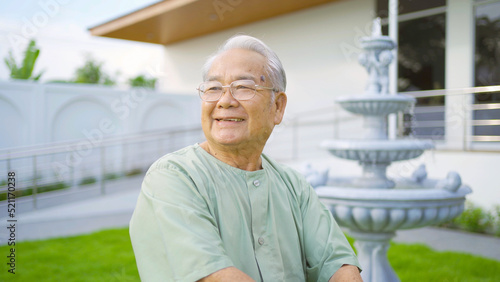 Portrait of happy old elderly Asian patient or pensioner people smiling, relaxing, in nursing home in garnden park. Senior lifestyle activity recreation. Retirement community. Health care photo