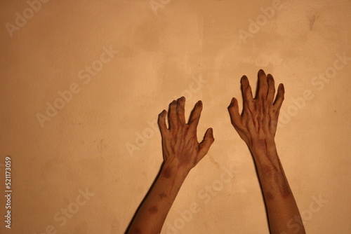 Halloween horror concept. Image of creepy ghost hand with black nails, isolated on background 
