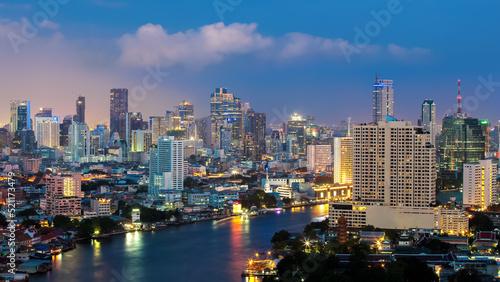Bangkok Transportation at Dusk with Modern Business Building along the river (Thailand) © molpix
