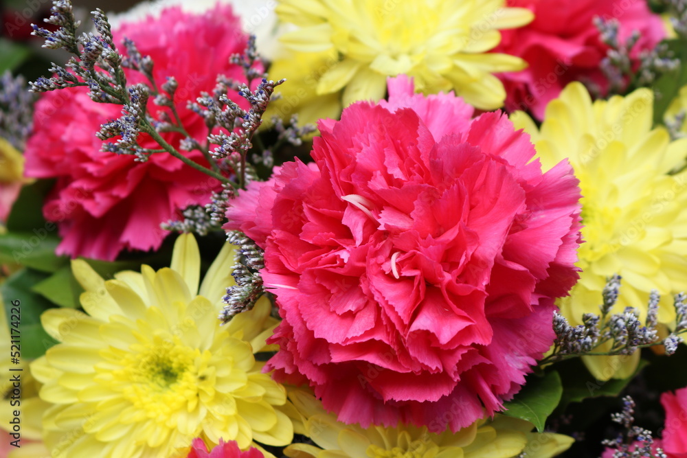 Close up view of a beautiful bouquet of mixed coloful flowers . The concept of a flower shop and flower delivery as a family business, florist work.