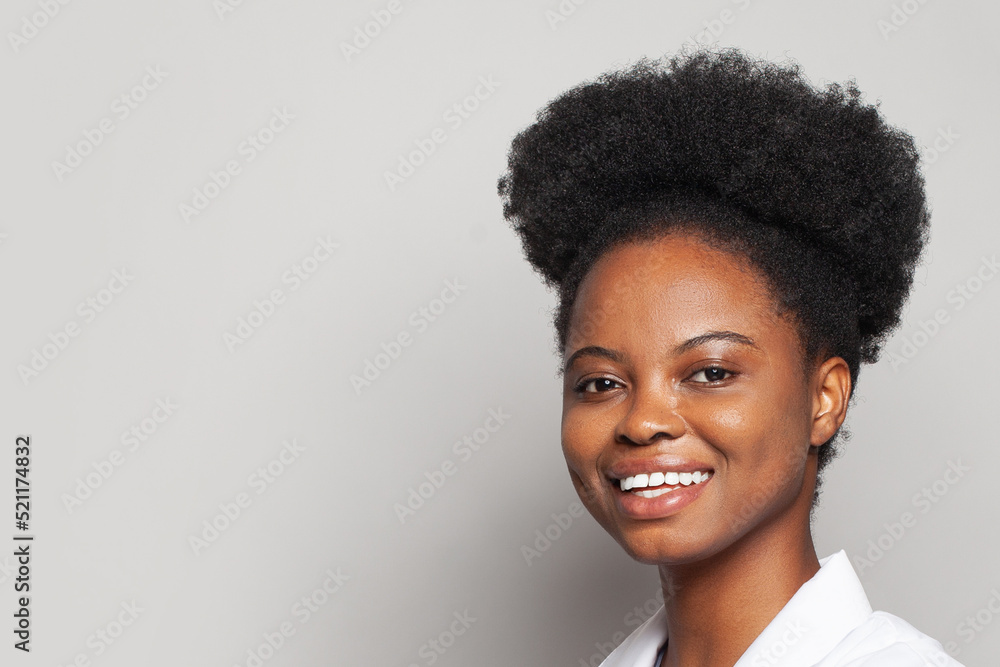 Beautiful black woman. Pretty cheerful woman with clean healthy skin on white background Beautiful black woman. Pretty cheerful woman with clean healthy skin on white background