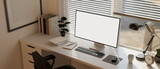Minimal white home workspace or office studio interior with PC computer mockup against the window