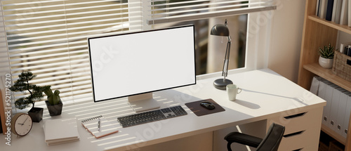 Fotografie Minimal comfortable white office room interior designs with computer desk, PC co