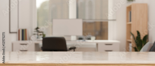 Modern white tabletop with copy space over blurred modern minimal office workspace