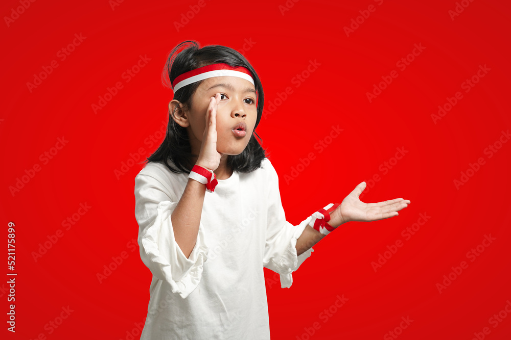 isolated girl using red and white ribbon Indonesian independence concept, screaming in empty space on red background isolated girl using red and white ribbon Indonesian independence concept, screaming in empty space on red background
