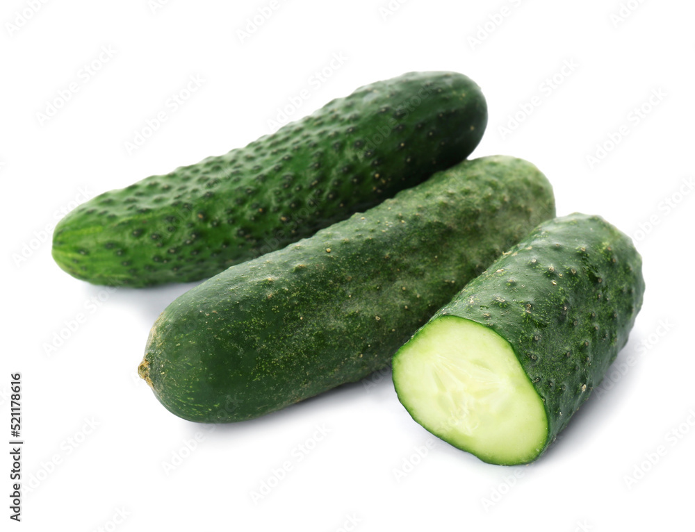 Whole and cut cucumbers on white background Whole and cut cucumbers on white background