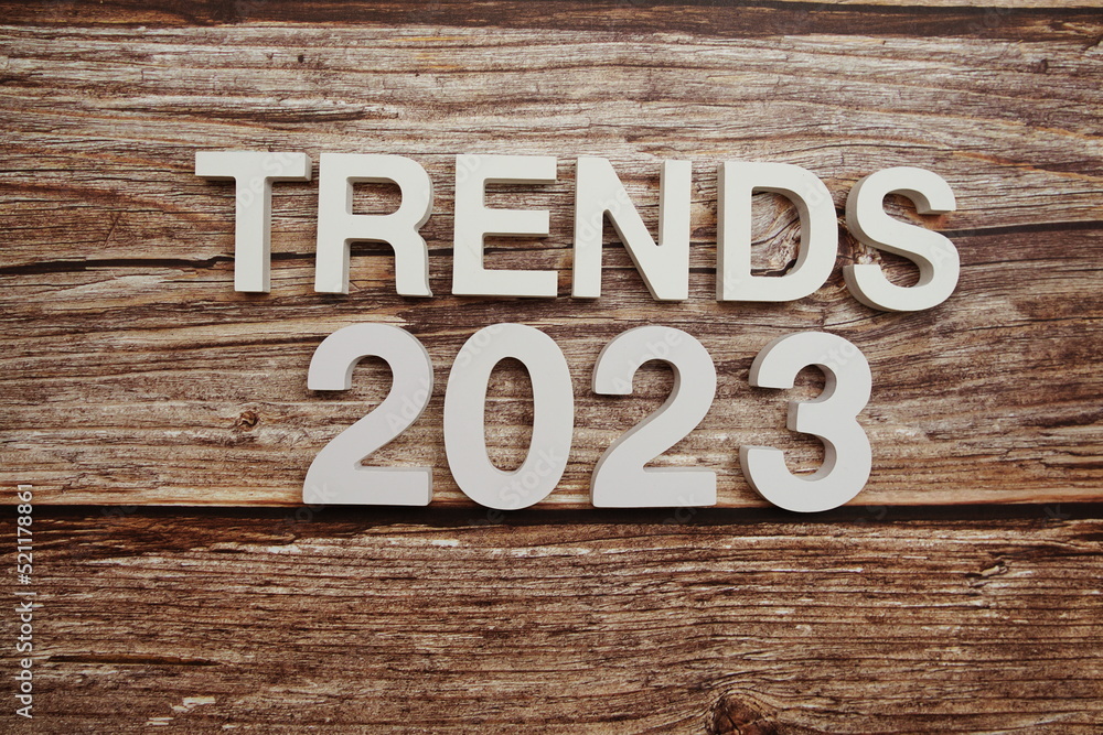 Trends 2023 alphabet letters on wooden background Trends 2023 alphabet letters on wooden background