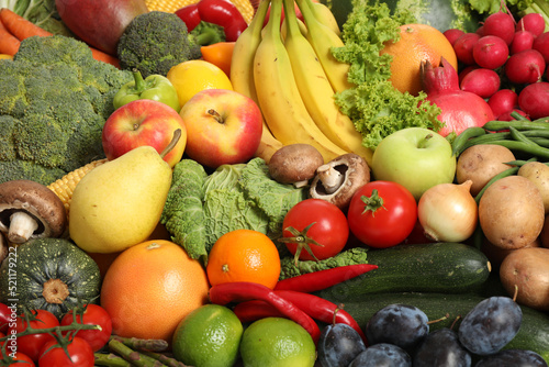 Assortment of fresh organic fruits and vegetables as background  closeup