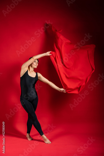 gymnast with cloth. ballet dancer at work, beautiful body girl, elegant girl, graceful woman, lady in black, athletic body, time show, fabric in flight, red silk in the air