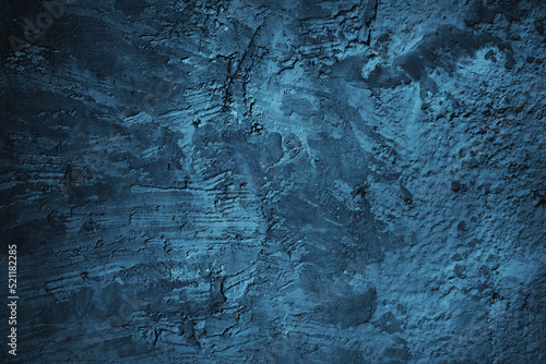 Abstract grunge blue stucco wall background. Dark stone wall concept background with space for text. © Adam