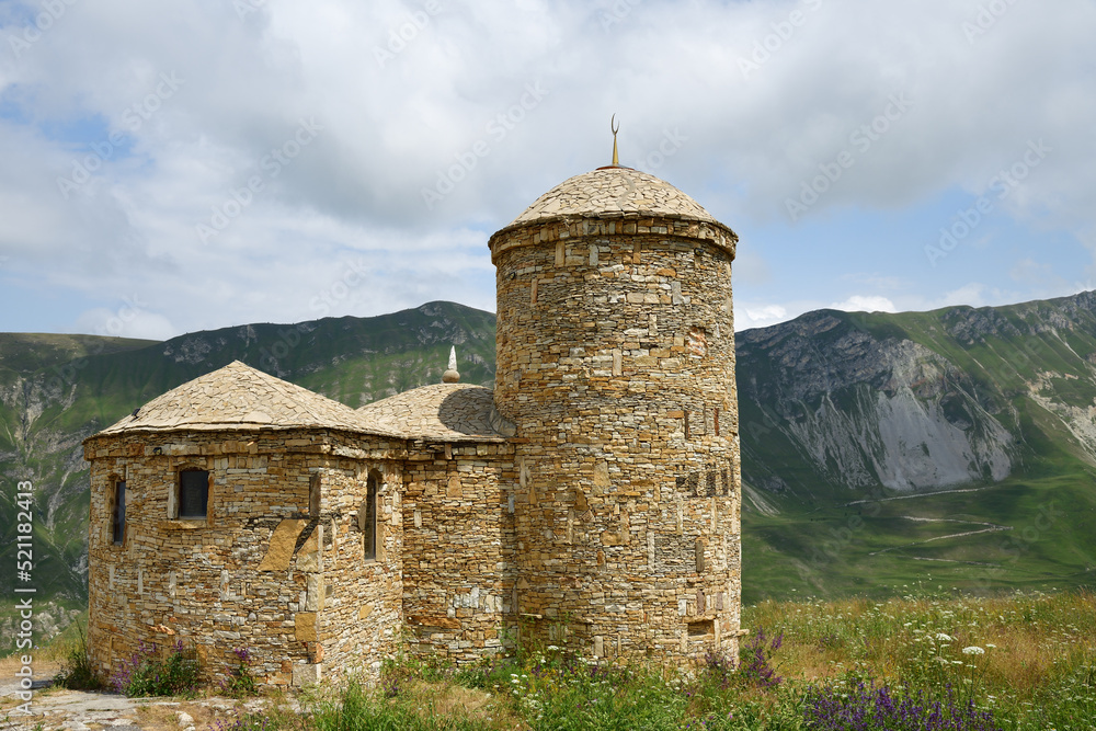 Mosque on Caucasus mountains background. Dagestan, Russia Mosque on Caucasus mountains background. Dagestan, Russia