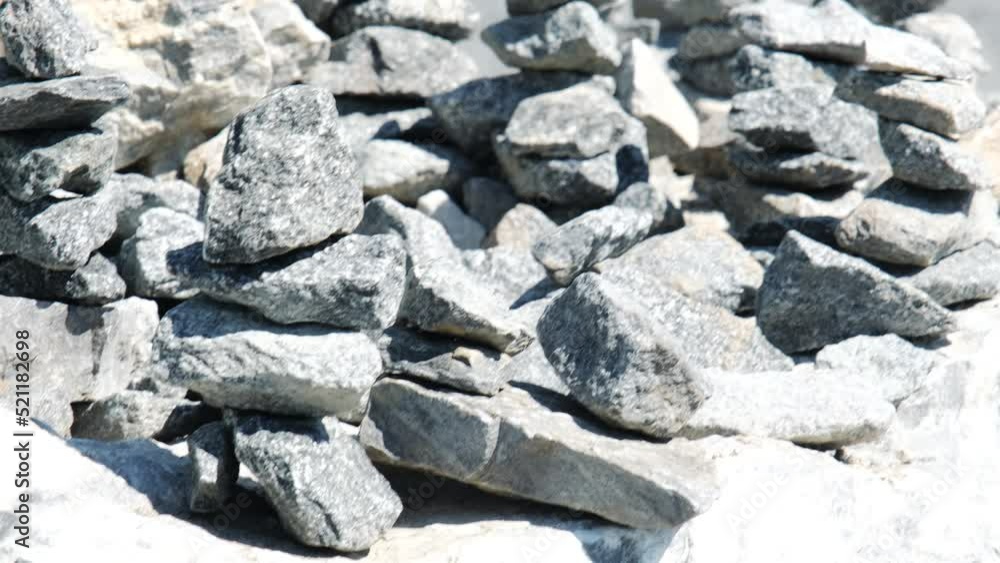 Karelia Russia. There are many towers made of stones in park made by people to make wish. Popular tradition among tourists is to build balance pyramids of stones. Close-up view. Karelia Russia. There are many towers made of stones in park made by people to make wish. Popular tradition among tourists is to build balance pyramids of stones. Close-up view.