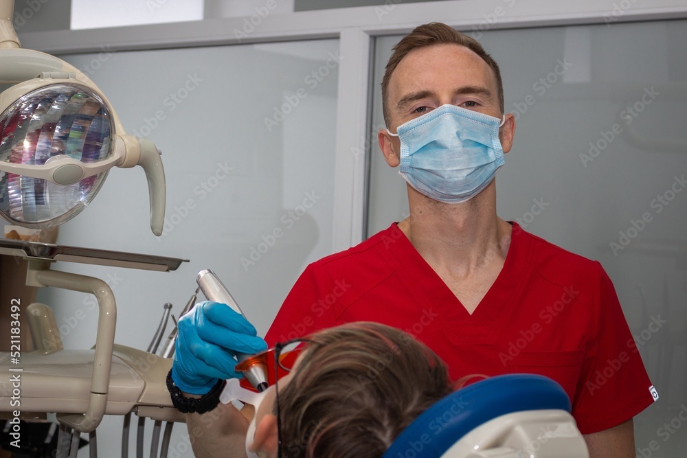 Fototapeta premium The dentist conducts the patient's appointment