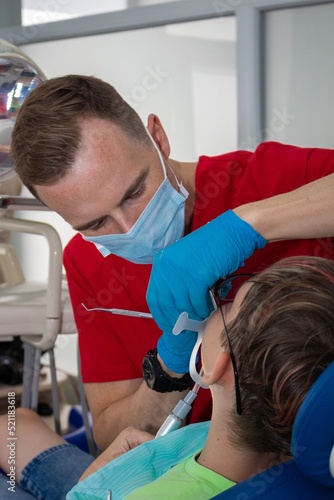 The dentist conducts the patient s appointment