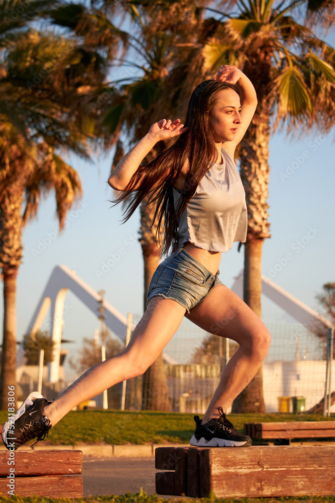 Young woman dancing in the park Young woman dancing in the park