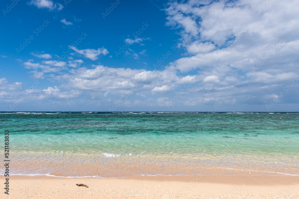 Fototapeta premium Crystal clear sea wave over white and clear sand.