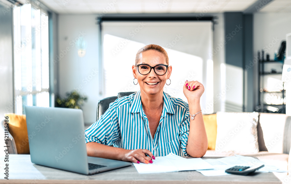 Beautiful mature businesswoman at her work