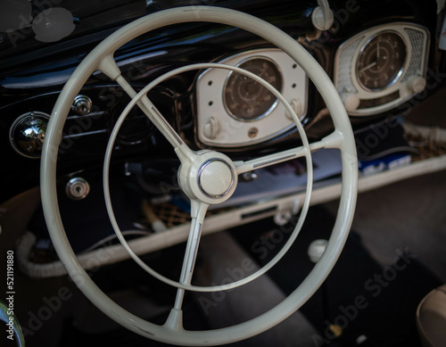 Dashboard and steering wheel of old-timer car