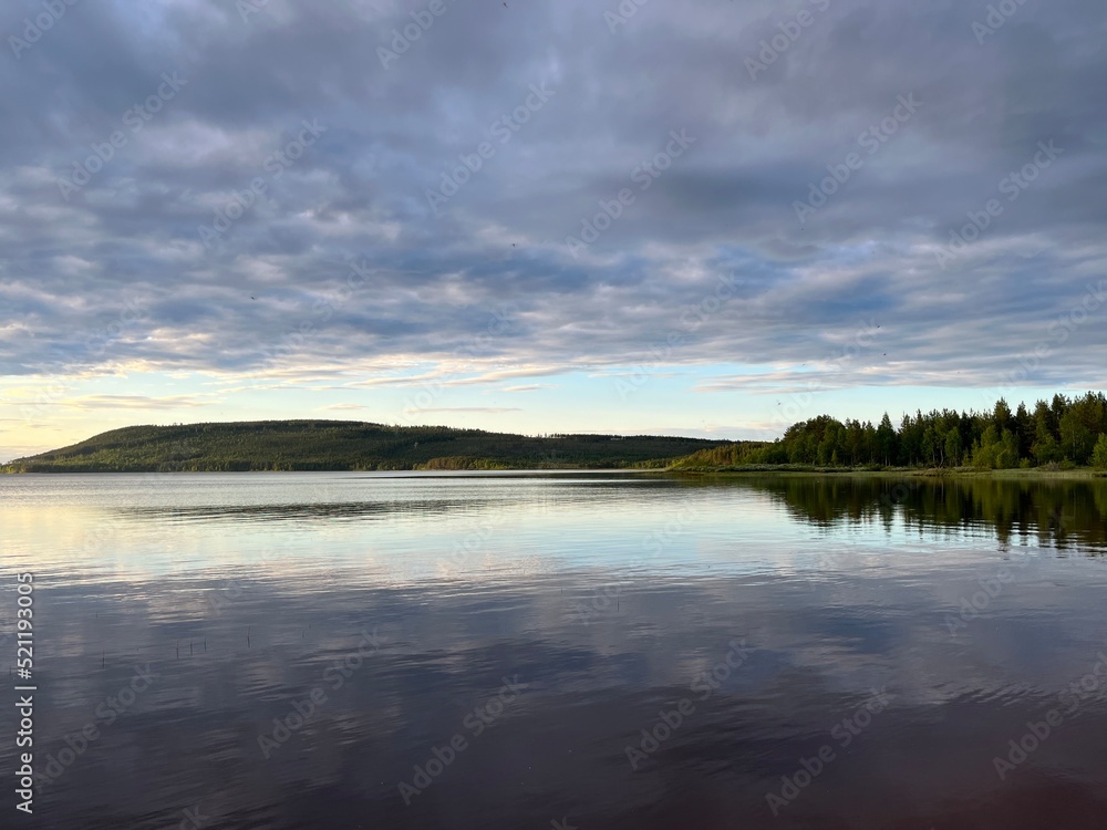 Sky reflection on the lake surface, cloudy sky Sky reflection on the lake surface, cloudy sky