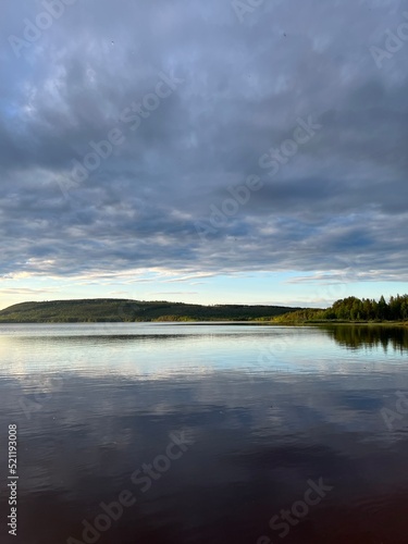 Sky reflection on the lake surface, cloudy sky