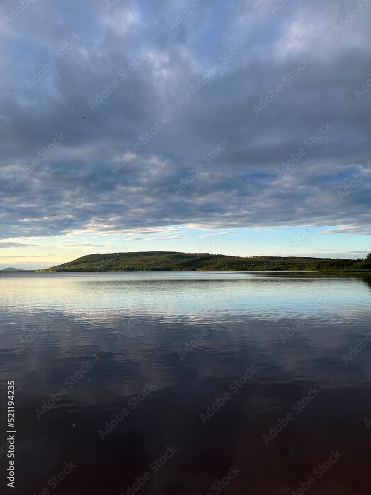 Sky reflection on the lake surface, cloudy sky Sky reflection on the lake surface, cloudy sky