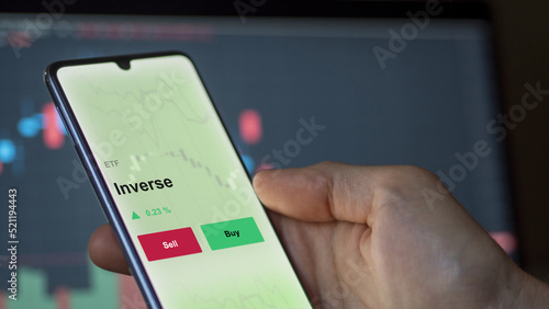 Photography An investor's analyzing the inverse etf fund on a screen