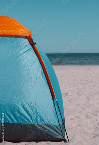 The tent is on the seashore.