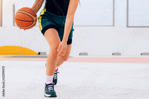 Athlete person playing basketball on a street court. Lifestyle, sport and wellness
