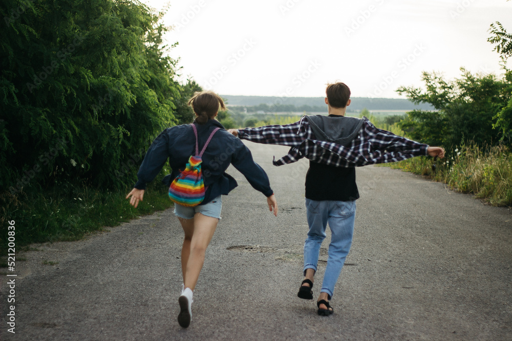 free people run on an empty road free people run on an empty road