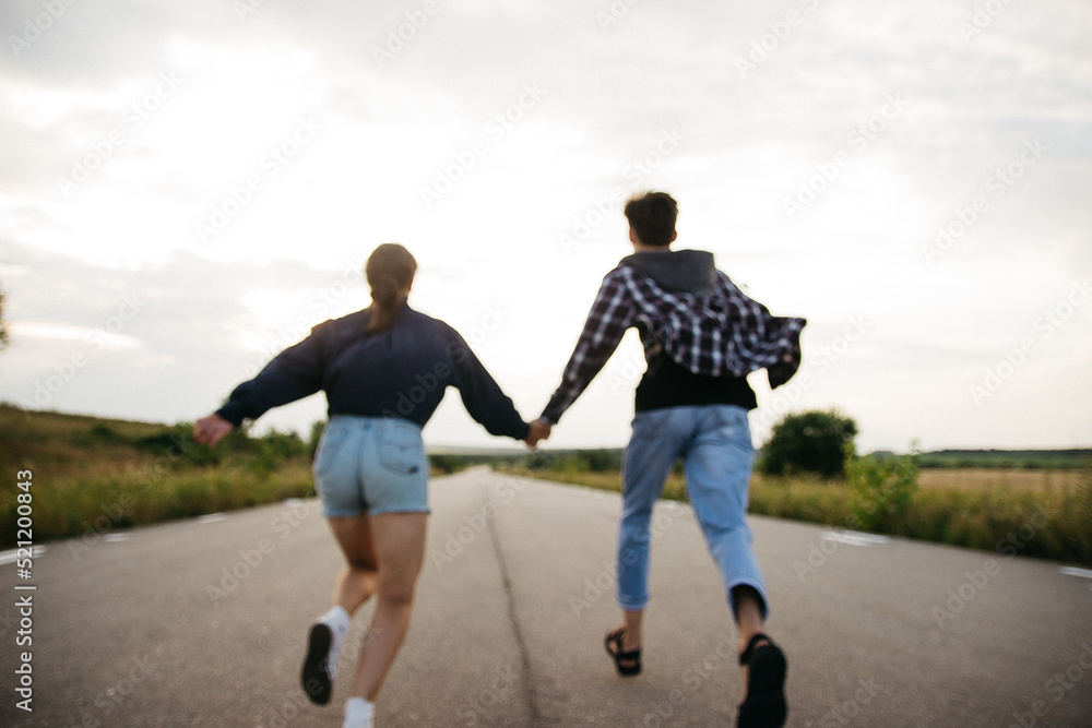 free people run on an empty road free people run on an empty road