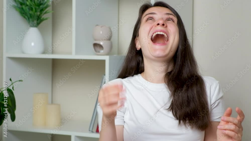A happy woman throws up a lot of bills of dollars and euros and laughs A happy woman throws up a lot of bills of dollars and euros and laughs