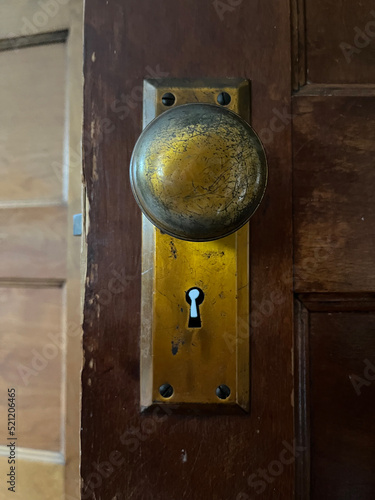 Old vintage brass doorknob with keyhole straight photo