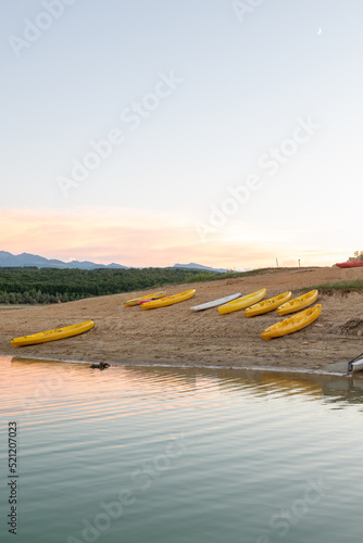 Sunset on Lake Montbel in Ariege with the boats in the summer of 2022