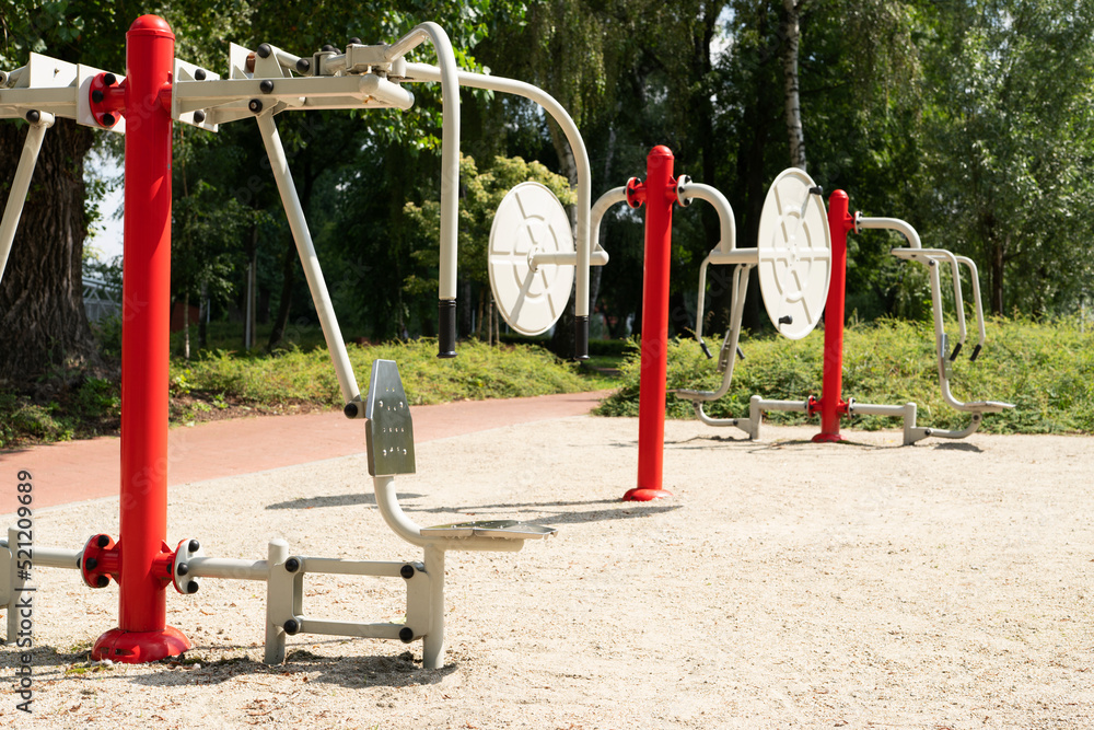 Outdoor gym in the middle of urban park. Free entrance for city residents.